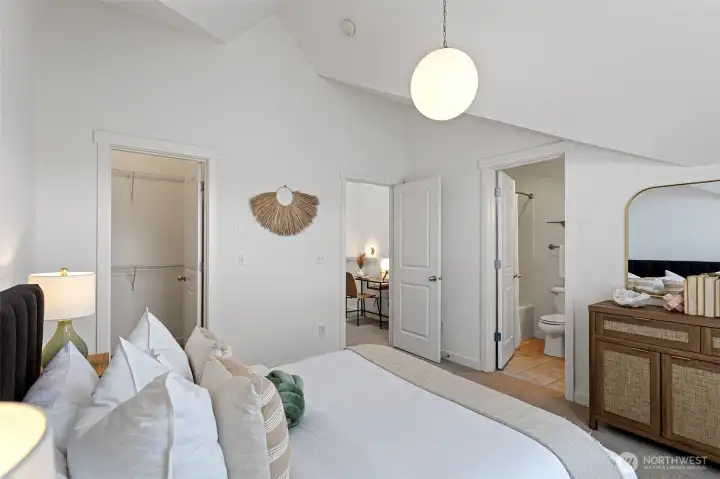 Second primary bedroom looking toward en-suite bath with walk-in closet on the left.