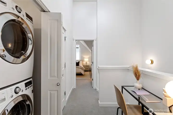 The laundry area features full-sized stackable LG washer and dryer.  There is an all-house fan in this area as well.