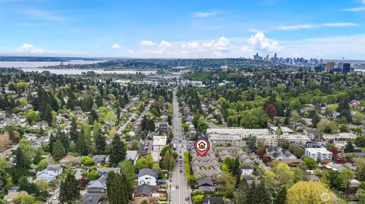 Drone shot looking south takes in University Village shopping center, University of Washington and downtown Seattle.