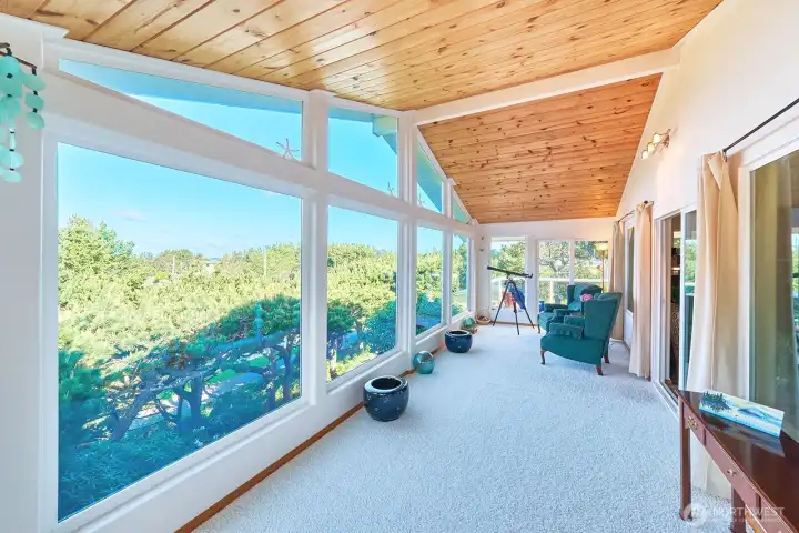 You will love spending time in this sunroom with ocean views