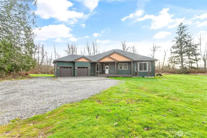 Welcome home to this gorgeous rambler on 5 enchanting acres!
