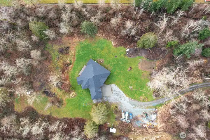 5 flat acres, lots of trees for privacy but open and filled with light. It's the perfect combination!