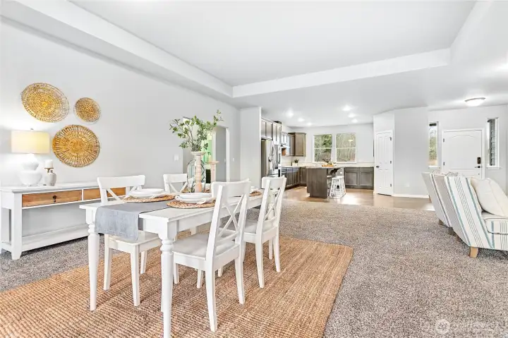 Easy flow from the kitchen into the dining and living room space, such a great design for entertaining as well as every day living.