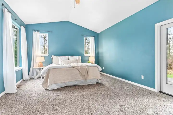 The primary suite is thoughtfully situated on one side of the home, away from the other bedrooms.