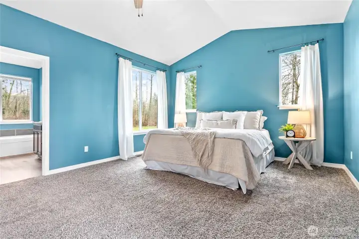 Vaulted ceilings and large picture windows let in the natural light.
