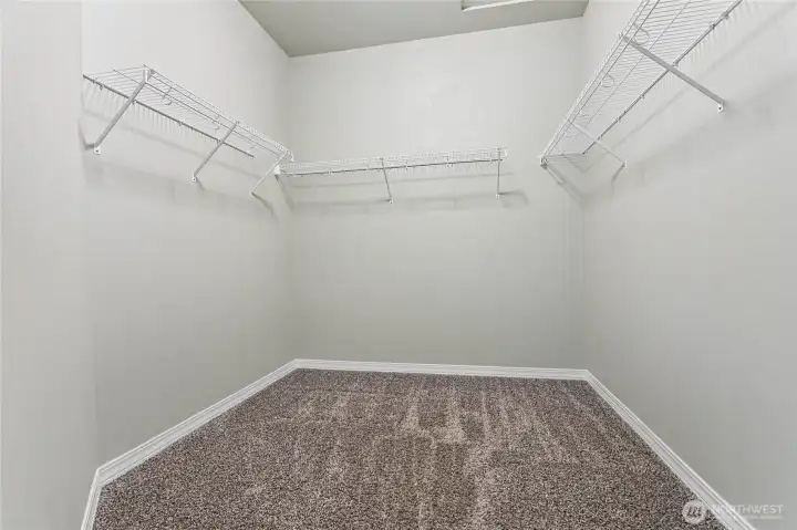 Large walk-in closet in the primary suite, with crawl space and attic access.