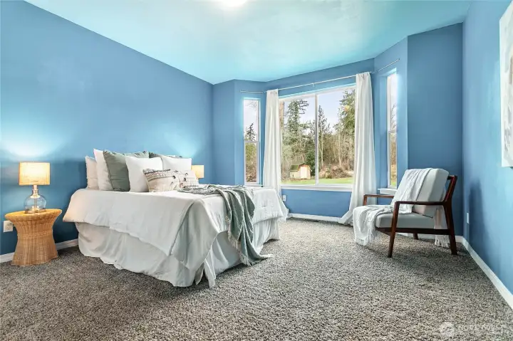 Room #2 on the other side of the home looks out to the front yard and is extra spacious. Could be a wonderful 2nd primary bedroom.
