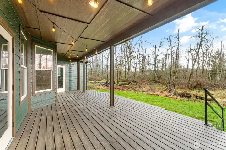 The back deck is generously covered and spacious enough for all your outdoor furniture. The perfect spot to sit and take in the gorgeous surroundings.