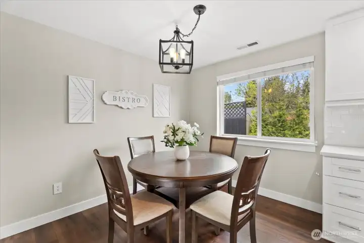 Dining space next to the kitchen takes advantage of the natural light.