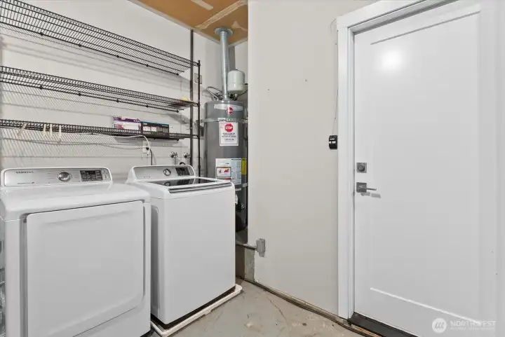 Full size washer dryer convey. Plenty of storage space in this garage, in addition to the upper storage space!