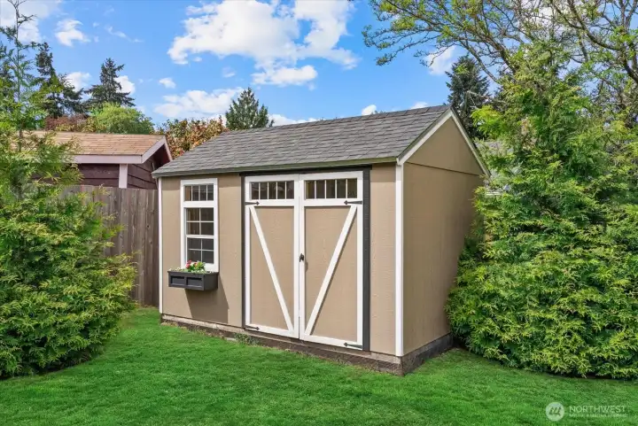 Spotless tool shed makes tool storage for yard maintenance a breeze.