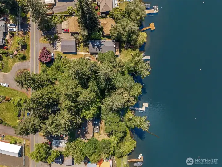 From this eastern-facing aerial perspective, you start realizing how incredibly rich this entire surrounding area is with natural beauty and recreation. Nearby Seven Oaks Elementary School sits just a few streets from the property, while further out you can see McAllister Community Park and the peaceful natural corridor surrounding McAllister Creek. Beyond that lies the Nisqually Indian Reservation and the broader watershed areas connected to the Nisqually River. To the left sits the stunning Billy Frank Jr. Nisqually National Wildlife Refuge, one of the Pacific Northwest’s most treasured wildlife habitats. The entire area surrounding this property feels deeply connected to water, wildlife and outdoor living while still remaining incredibly accessible to Lacey amenities and freeway access nearby.