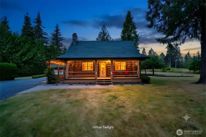 Front view of the home boasting two large decks to enjoy the serenity of nature.