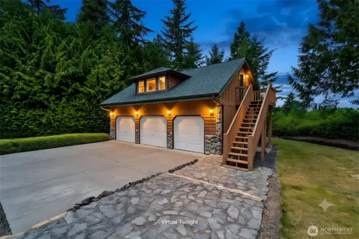 816 Sq. Ft., 3 bay garage has painted sheetrock walls, recessed lighting and plenty of room! A huge bonus is the beautifully finished space above the garage!