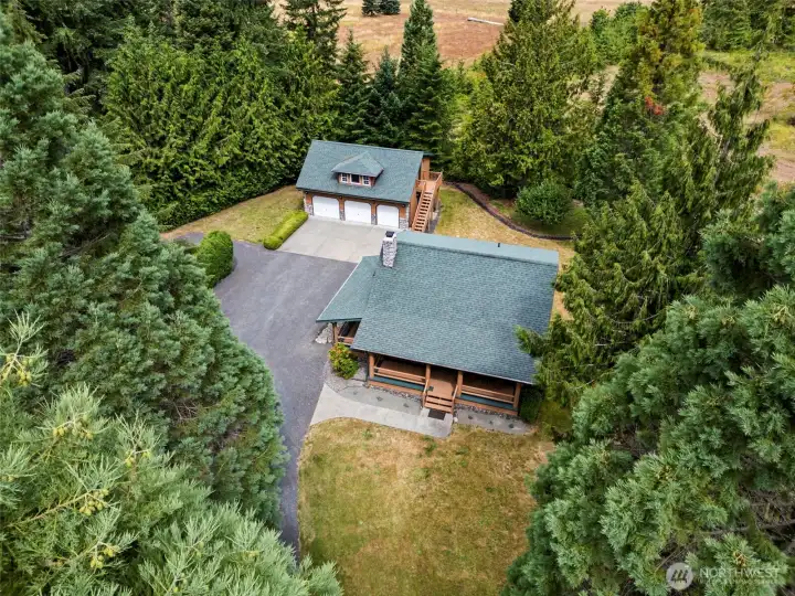 Aerial view of the home and meticulously manicured yard.