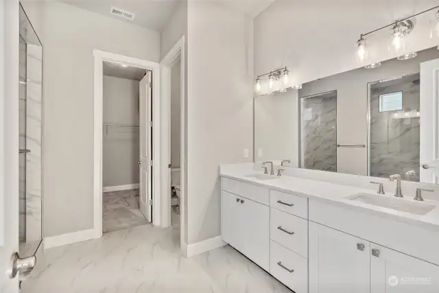 Primary bathroom with spacious walk-in closet