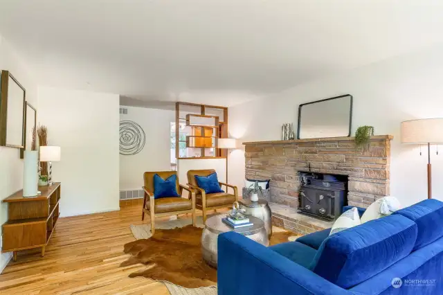 Wonderfully spacious mid-century living space w/beautifull, refinished hardwoods and architectural shelving