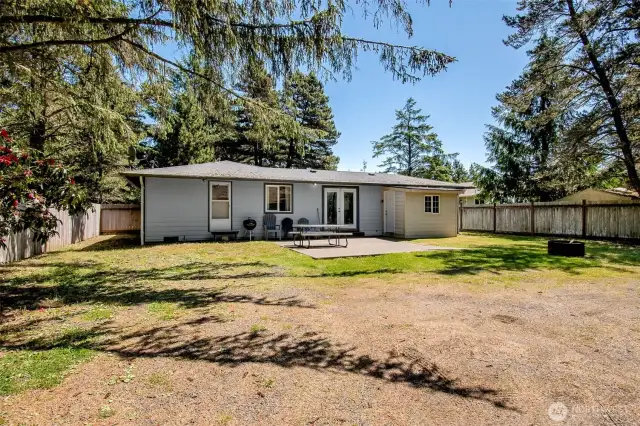 View of back patio and back of home, small room to the left is the extra large laundry room!