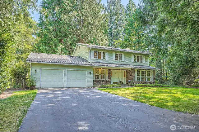 Impressive long driveway up to 2 car garage.