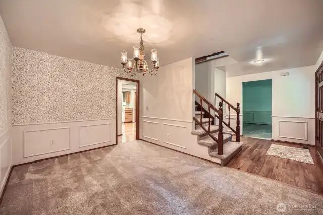 Formal Dinning keeping in tradition of colonial with wanes coating and wall paper.