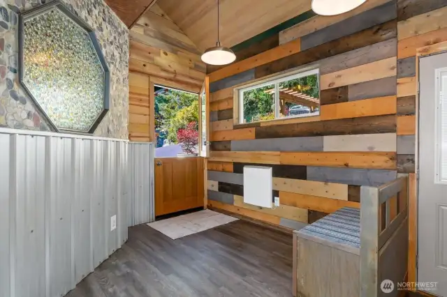Front door entry into a fun & modern mudroom.