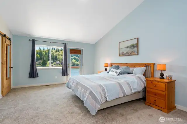 Primary suite with private balcony overlooking the lake.