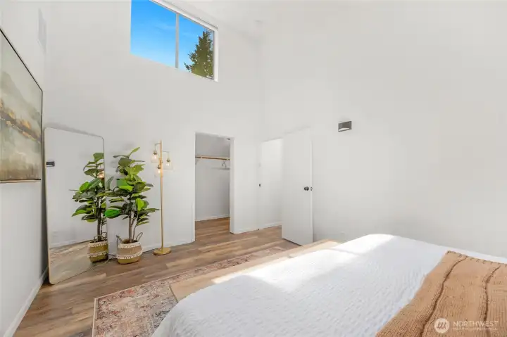 Primary bedroom with sky high vaulted celings.