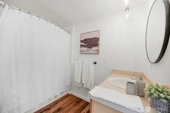 Main upstairs bath with new flooring.
