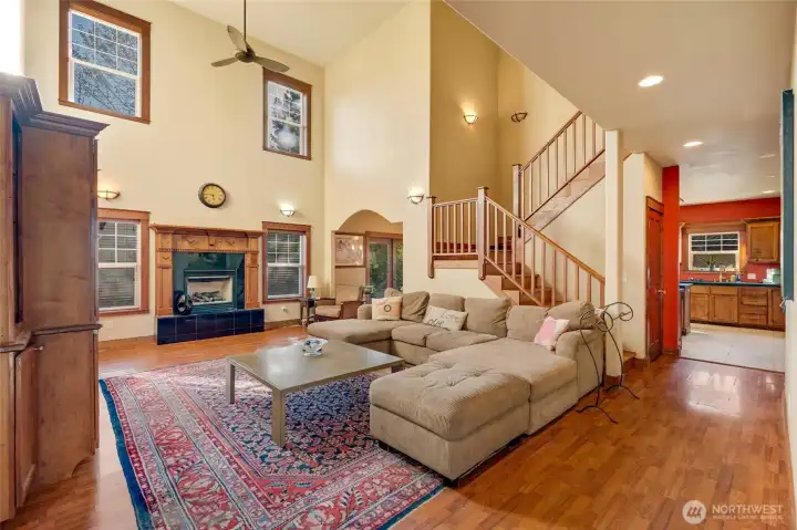 Entertain in the great room with custom wood built-ins and gas fireplace, where you will enjoy abundant natural light and soaring ceilings.