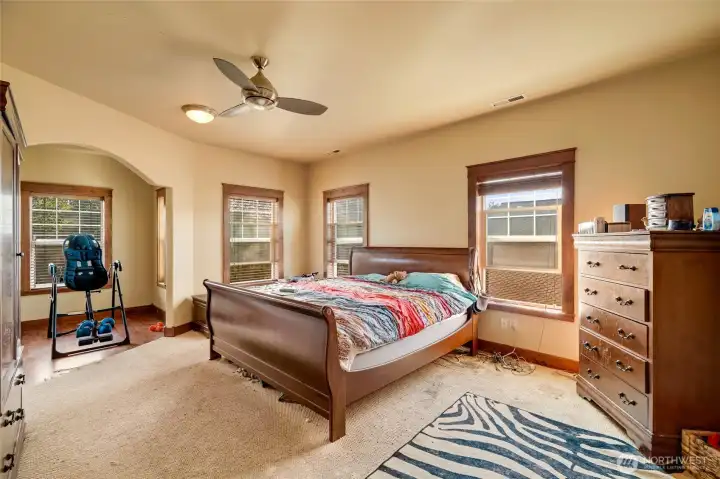 Large primary suite with a peek into a flex space.