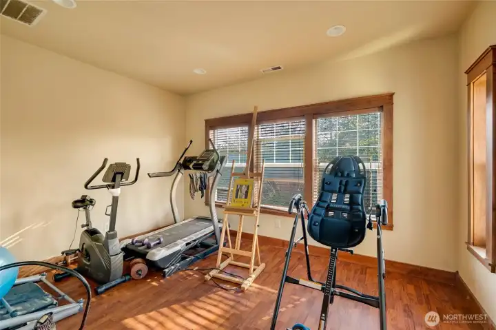 This flex space off the primary suite could be used as an exercise room, home office, sitting room, even a nursery!