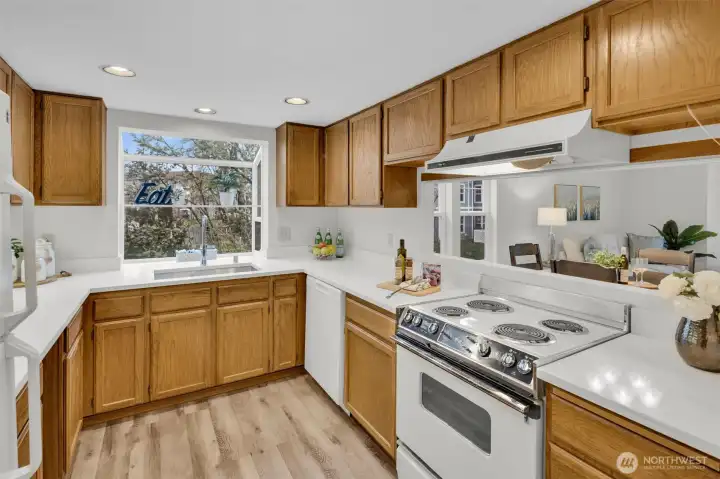 Charming garden window faces community pea patch