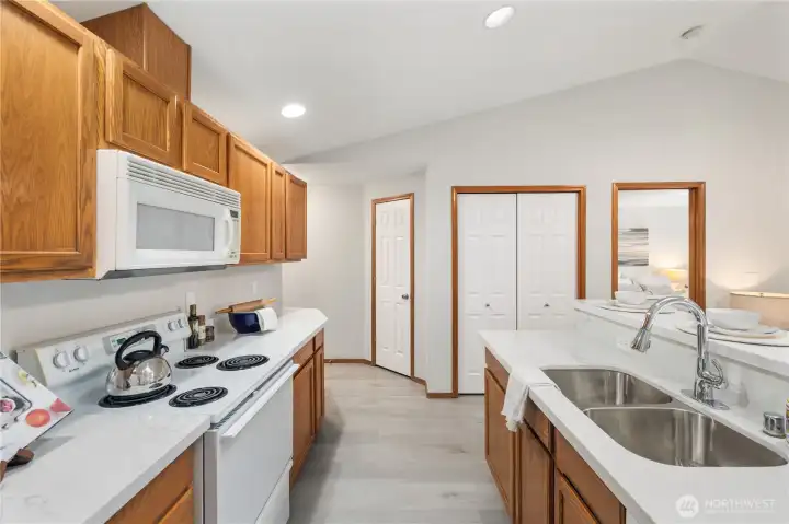 Kitchen with new sink and faucets.