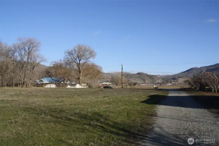 Property and driveway off of Chesaw road, views of fruit trees across the driveway.