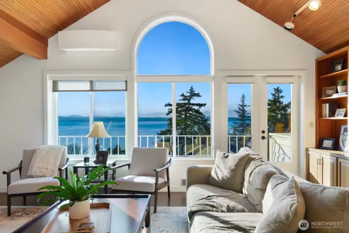 . The upper level offers incredible flexibility, currently functioning as a family room or office, with potential to convert into a luxurious primary suite.