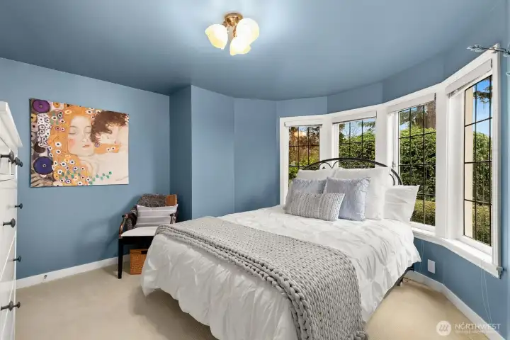 A fifth bedroom, gym or flex space, and access to the one-car garage with EV charging complete this level.