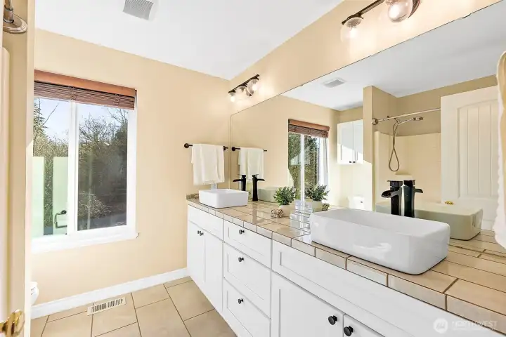 Upstairs bathroom with double sinks.