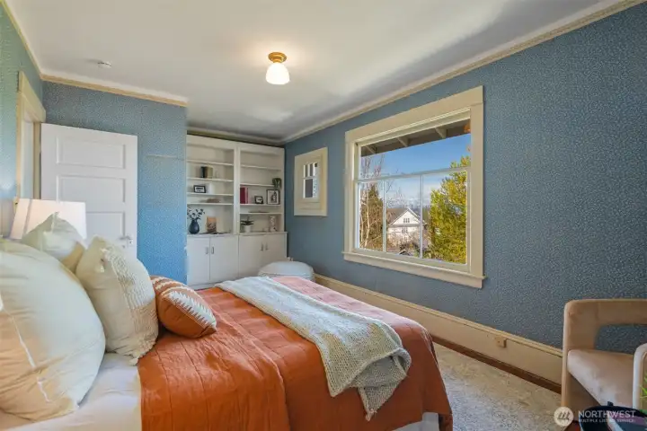 The first of 3 upper bedrooms, each with deep walk-in closets