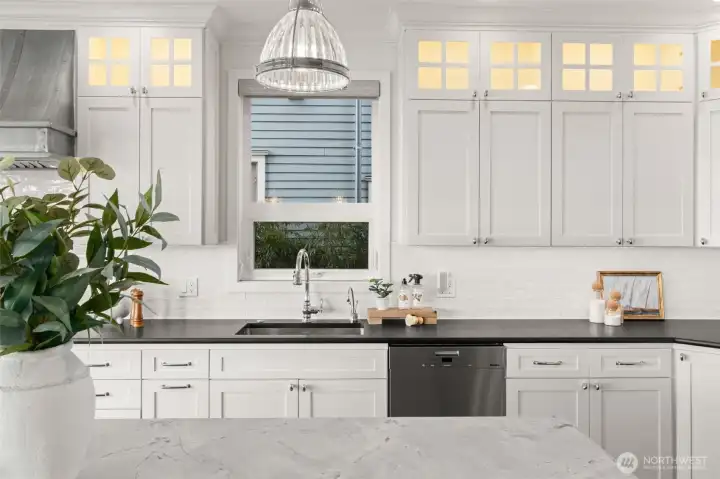 Honed marble countertops and leather soapstone surround