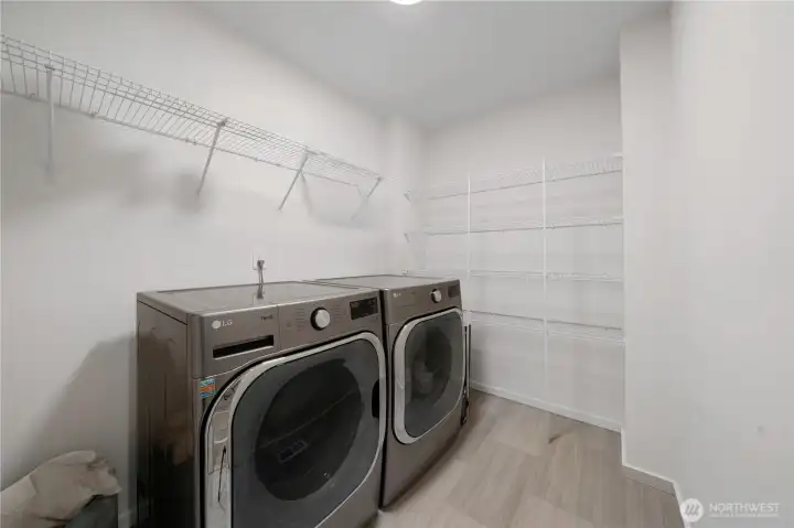 Full size machines and roughed in for utility sink