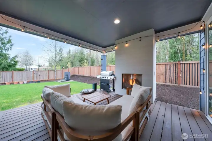 Cozy covered patio with gas fireplace
