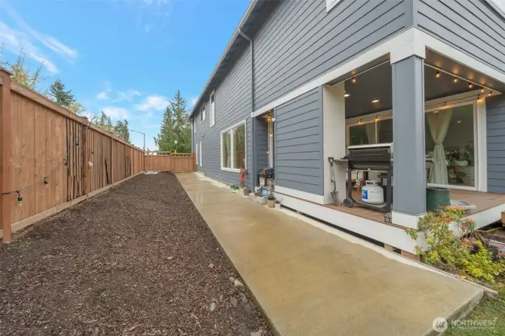 Concrete-paved side yard