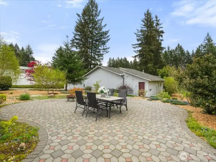 What a patio space! And steps down to your hangar.