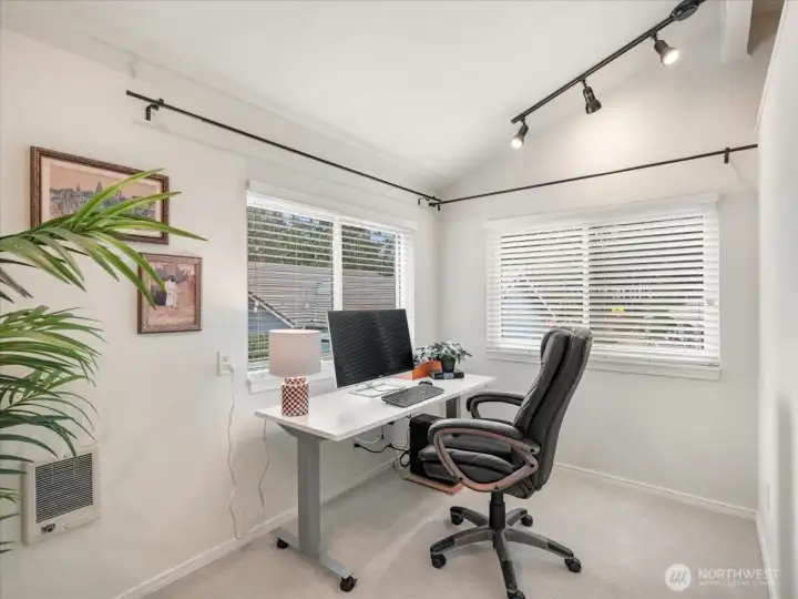 The private windowed space off the primary bedroom could be a home office or quiet retreat to read and relax.