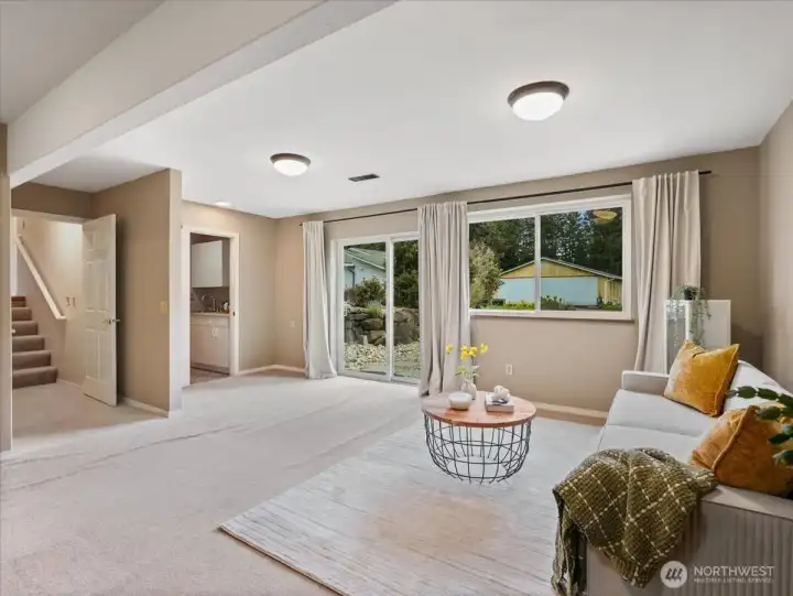 The lower level rec room has a half bath and slider to the backyard.