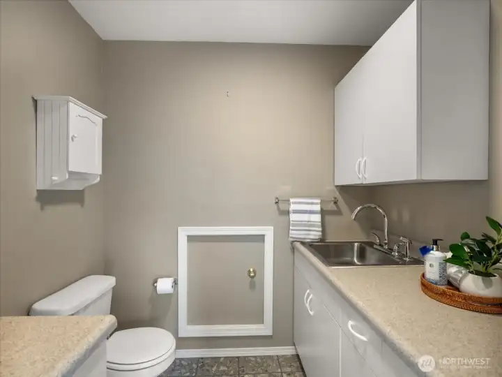 Powder room and extra sink space.