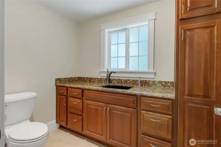 half bath off garage door entry and utility room