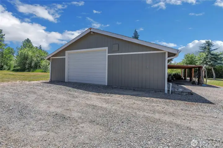 Back garage: 30' x 64', 200A/ 240V electrical service, insulated with hydronic heated floor and custom stained concrete