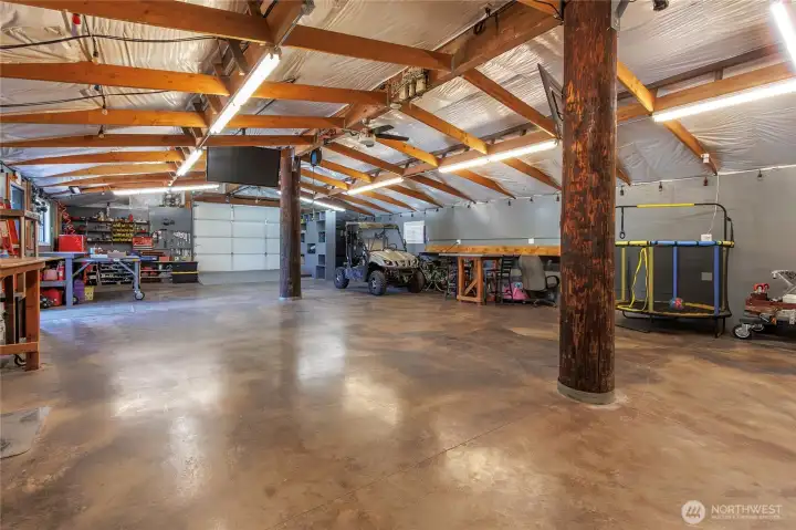 Back garage: 30' x 64', 200A/ 240V electrical service, insulated with hydronic heated floor and custom stained concrete