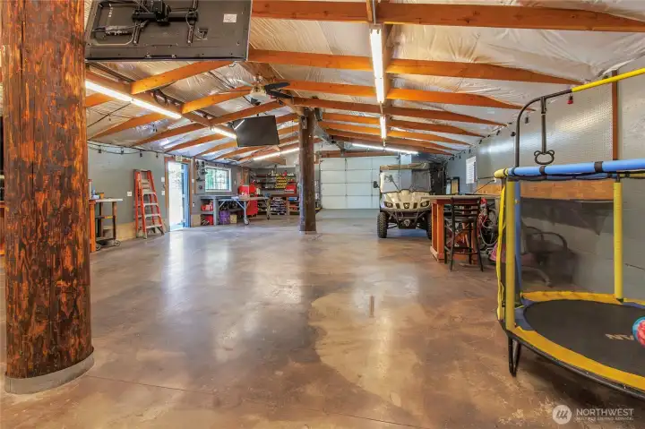Back garage: 30' x 64', 200A/ 240V electrical service, insulated with hydronic heated floor and custom stained concrete